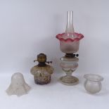 A painted glass oil lamp with a shade and chimney, height 50cm, another oil lamp and 2 glass light