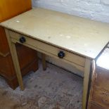 A 19th century painted pine side table, single frieze drawer, raised on square tapered legs,