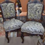 A pair of 19th century upholstered and rosewood-framed hall chairs, with carved floral decoration,