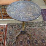 A Victorian walnut occasional table, with relief carved top, on tripod base, W53cm, H75cm