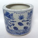 A reproduction Chinese blue and white jardiniere with dragon decoration, height 30.5cm
