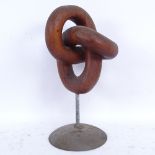 A modernist carved hardwood abstract trefoil knot sculpture on metal stand, unsigned, overall height