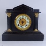 An Ansonia painted cast-iron mantel clock, enamel dial with Corinthian column supports, height 32cm