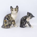 A Winstanley Pottery figure of kitten licking its paw, and a larger Winstanley tabby kitten,