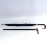 A Vintage snakeskin-handled parasol, and a stag horn-handled ebony walking cane with silver