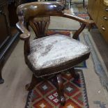 A Victorian mahogany-framed and leather-upholstered revolving desk chair