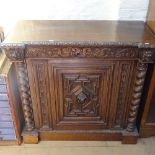 A Victorian oak inverted break-front side cabinet, with acanthus leaf carved edge, lion mask mounts,