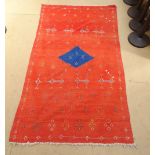 A red ground flat weave Kilim rug 217 x 130 cm