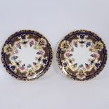 A pair of Royal Crown Derby plates finished in gold, 21.5cm