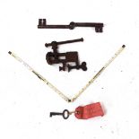 A pair of Antique combination swivel keys, a small watchmaker's vice, and a William Campbell ivory