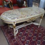 A Continental painted and gilded oval coffee table with marble top, on shaped stretchers