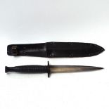 A Fairbairn-Sykes Commando fighting knife, and leather scabbard, blade length 15cm