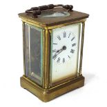 A brass-cased carriage clock, case height 11cm, not currently working, with key
