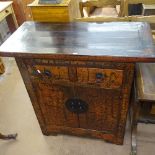 A Chinese elm lacquered side cabinet, 2 frieze drawers, panelled cupboards under, W95cm, D46cm,