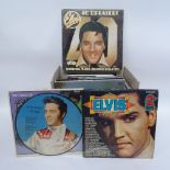A collection of Elvis vinyl LPs, records and books