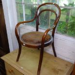 An early 20th century child's bentwood armchair, label for J R Roberts Stores Ltd London