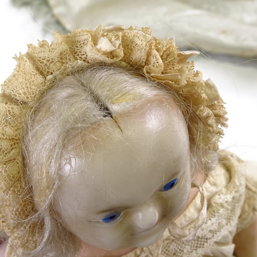 A Victorian wax head and limb doll, with painted blue eyes and features and inserted hair, in - Image 9 of 9