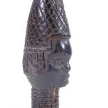 An Antique Benin stained ivory Queen mother head with neck rings, height 18cm. Probably late 19th
