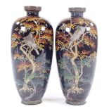 A pair of Japanese Meiji period cloisonne vases, dark blue enamel bodies with eagles in Acer