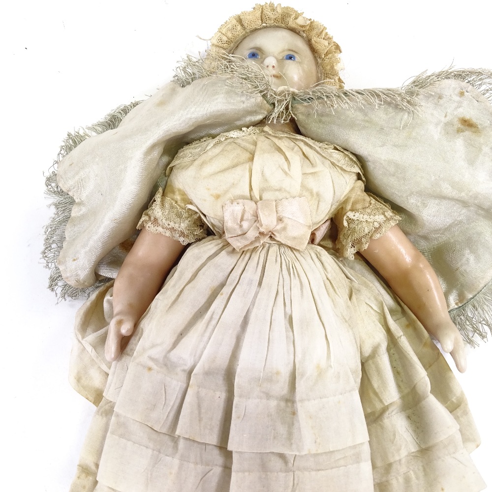 A Victorian wax head and limb doll, with painted blue eyes and features and inserted hair, in - Image 3 of 9