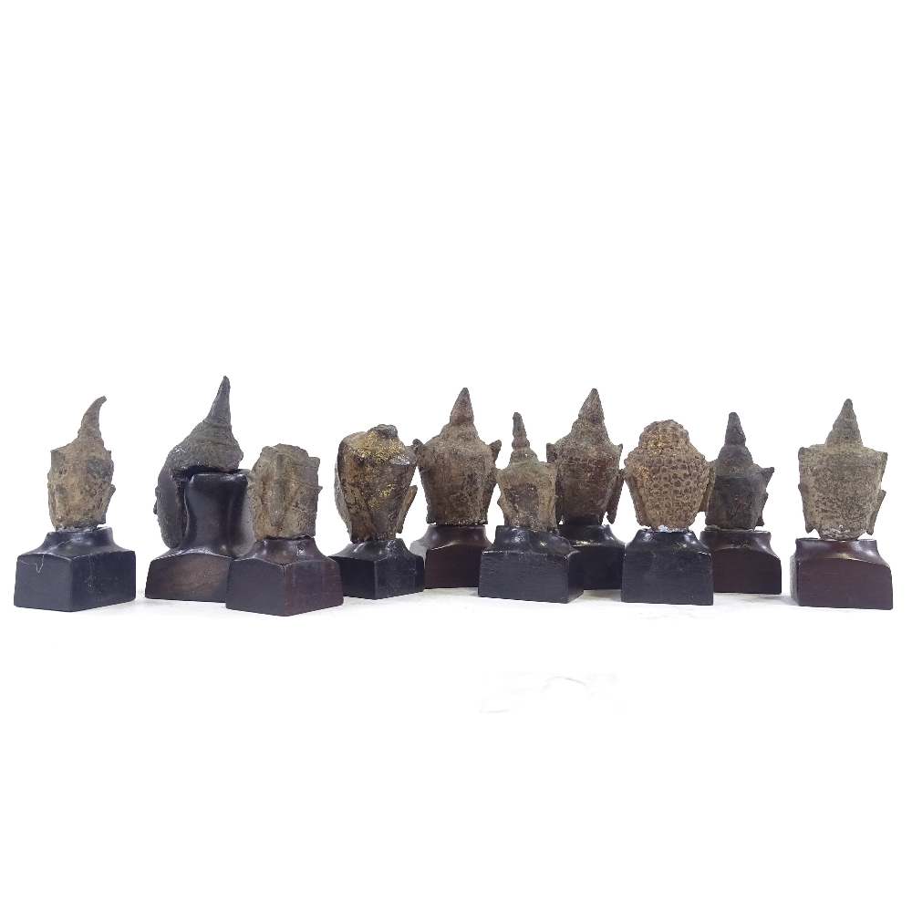10 miniature cast bronze Thai Buddha heads, with later made hardwood stands, tallest 6cm with stand. - Image 3 of 5
