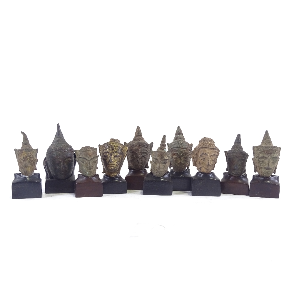 10 miniature cast bronze Thai Buddha heads, with later made hardwood stands, tallest 6cm with stand. - Image 2 of 5