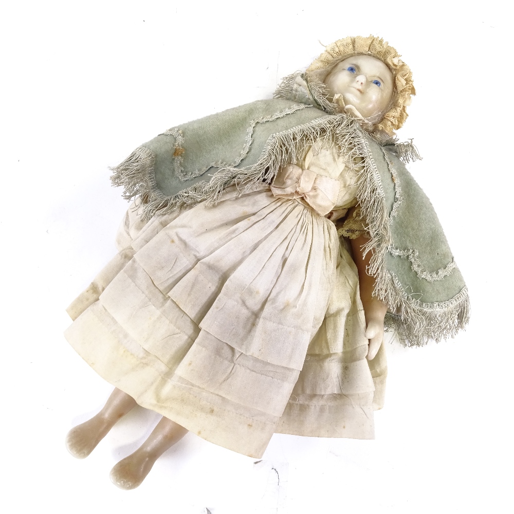 A Victorian wax head and limb doll, with painted blue eyes and features and inserted hair, in - Image 2 of 9