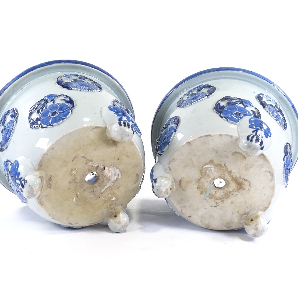 A pair of Japanese Meiji period blue and white porcelain jardinieres, with relief flower panels - Image 11 of 13