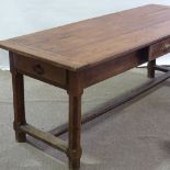 An 18th century fruitwood refectory farmhouse table, with 3cm thick plank top and 3 frieze