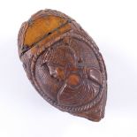 An early 19th century coquilla nut snuff box, carved classical figure on lid and woman on base