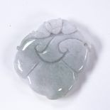 A Chinese relief carved jade pendant, 4.5cm across