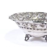 A sterling silver circular bon bon dish, relief embossed strawberry and leaf decoration with foliate