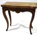 A 19th century walnut fold over card with carved frieze and cabriole legs, width 83cm