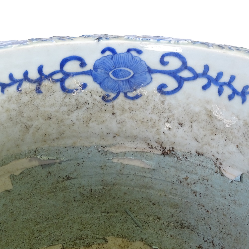 A pair of Japanese Meiji period blue and white porcelain jardinieres, with relief flower panels - Image 8 of 13