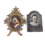A 19th century painted porcelain plaque, depicting a woman and child in carved giltwood frame,