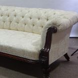 A 19th century carved mahogany-framed sofa, with buttoned upholstery and carved show-wood front,