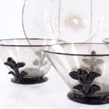 A set of 3 Venetian gold speckle glass bowls, with applied black glass mounts, 13cm across, and a