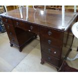 An Edwardian mahogany writing desk, with satinwood banding, fitted with 9 short drawers, on