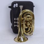 A Stagg 77-MT gold lacquered 3-valve pocket trumpet, serial no. 3419, length 24cm, in original Stagg
