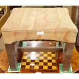 A Liberty's upholstered oak footstool, on H-shaped stretcher, with label to the underside, and a