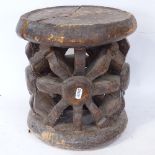 An African Tribal carved and stained hardwood ceremonial seat, seat height 30cm