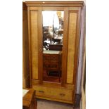 An Edwardian walnut single mirror-door wardrobe, with drawer fitted base, W97cm