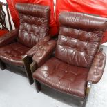A pair of Scandinavian design and leather-upholstered armchairs