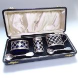 An Edward VII 3-piece silver cruet set with Bristol blue liners, hallmarks for Chester 1908/09,