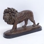 A modern resin lion sculpture, dated 2003 Spring, on plinth, plinth length 42cm