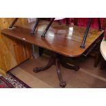 A Regency mahogany Pembroke table, with end frieze drawer, raised on turned centre column, sabre leg