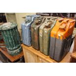 4 Vintage jerry cans, and a painted heater cover