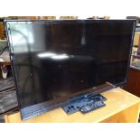 A Bush 32" flat screen TV with remote, GWO