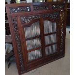 A large Indian carved and pierced hardwood window wall panel