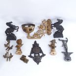 A gold painted wrought-iron swivel wall light mount, pair of black painted spelter Marley horse
